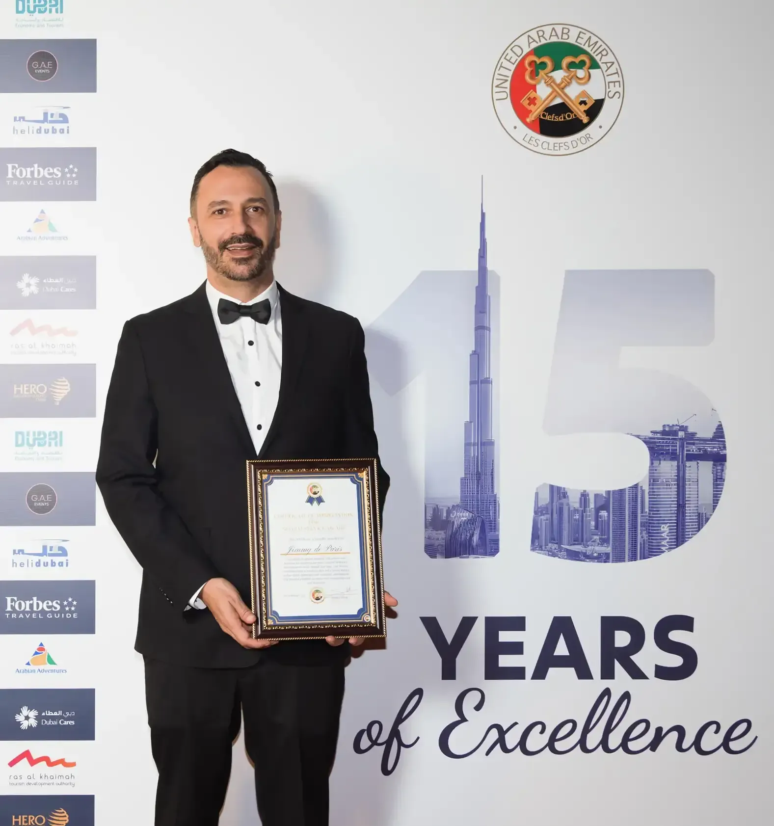Jimmy de Paris holding his Special Service Award certificate at the Les Clefs d'Or UAE 15 Years of Excellence gala